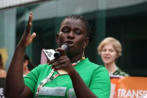 Shepherded by Anxious Security in Humidity-fueled Heat, Activists Plead for Climate Justice